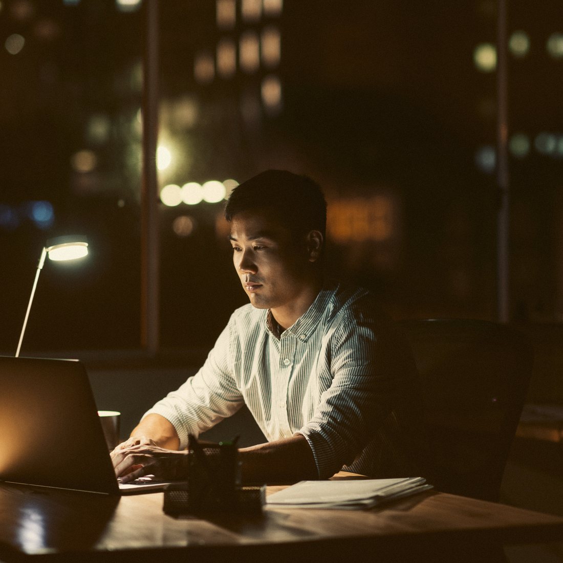 A writer working late at a desk