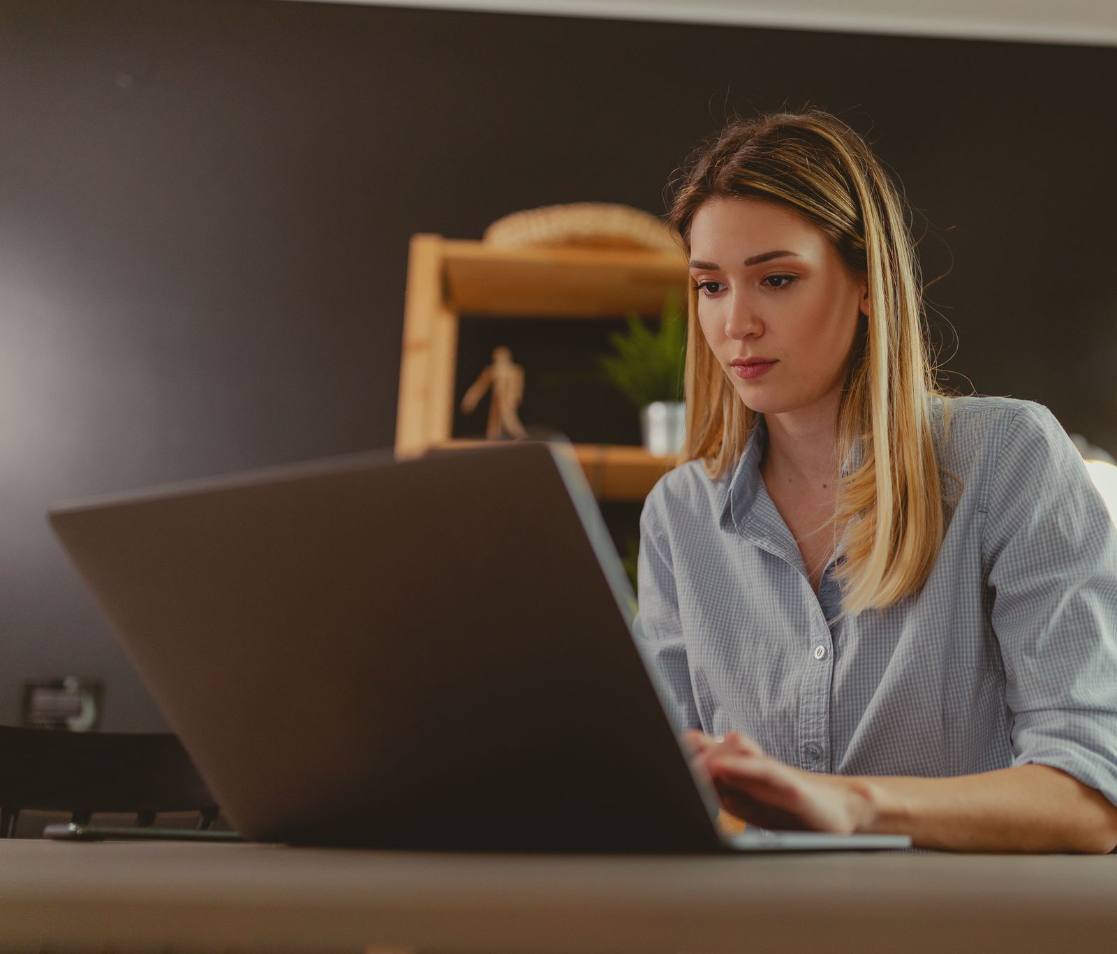 A writer working at a desk at home